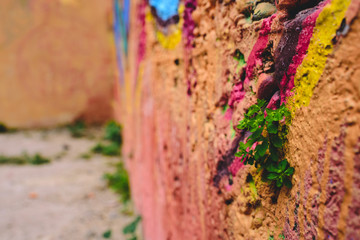 Detail of an anonymous street graffiti with many colors, cheerful urban background.