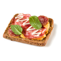 Canape with salami. Open faced sandwich crostini isolated on white background closeup. Appetizer tartarine.