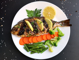 Roasted dorada fish with vegetables