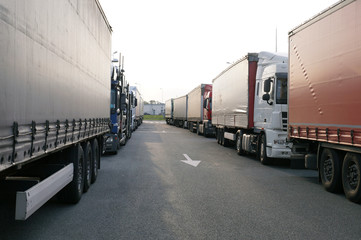 Crowded truck parking lot. Drivers try to park so as to take up as little space as possible.