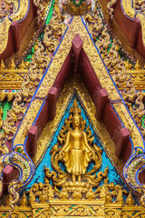 Obraz premium Ko Samui Island, Thailand - March 18, 2019: Wat Laem Suwannaram Chinese Buddhist Temple. Golden statue of Guan Yin in Elaborately decorated full of colors front facade.