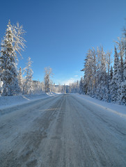 Snowed road through the winter forest in Manning Park, BC.