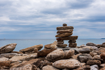 stack of stones  (inukshuk) on the beach 