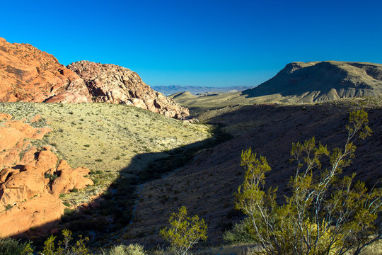 Bright sunshine and contrasty shadows in late afternoon in Red Rock Canyon in Nevada