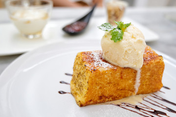 Close up Dessert of honey toast with ice cream and whip cream.