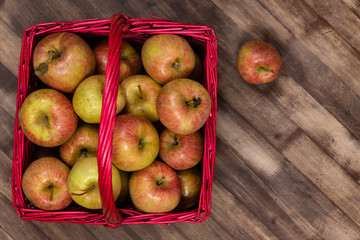 Honey Crisp Apples in a Red Wicker Basket