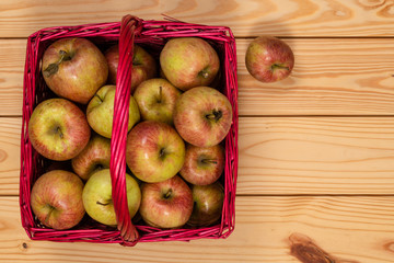 Honey Crisp Apples in a Red Wicker Basket