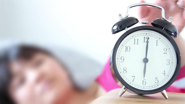 Daylight Saving Time woman waking up