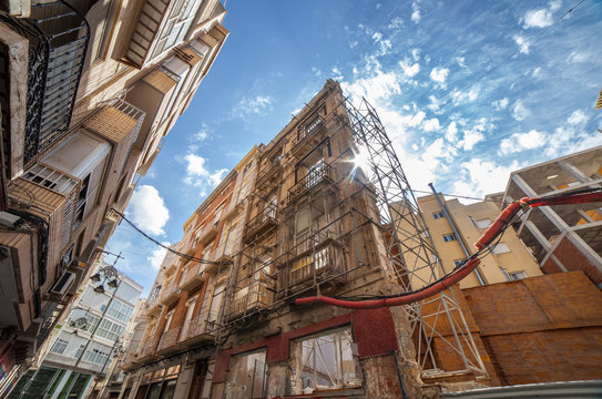 Historical building facade with supporting structure in order to preserve it while new building is erected