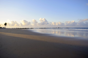 Deserted beach with blue sky at dawn