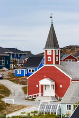 The Cathedral of Our Saviour Annaassisitta Oqaluffia and colorful houses in Nuuk, Greenland. © Ruben