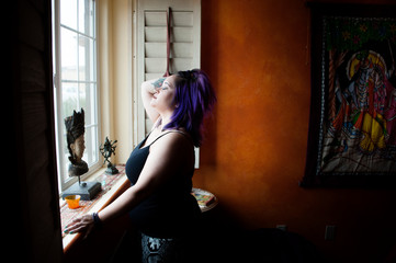 Self and body positivity spiritual woman at her window. 