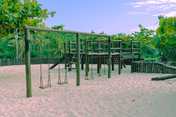 park with swing and cottage