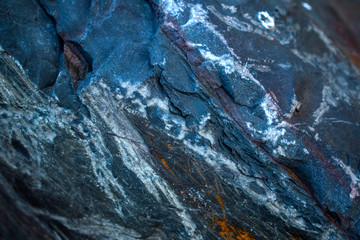 texture blue stone with white streaks and red stripes