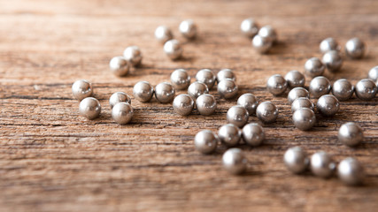 Selective focus of Many Bullet of  Shotgun on wooden background with sunlight