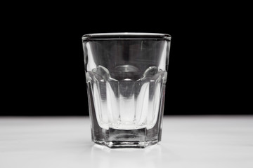  Shot glass  on white and black background