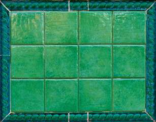 3x4 green glazed glossy tiles with floral dark frame, empty surface for backgrounds and backdrops.