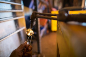 Construction worker hand  lighting flint  on oxy cutting torch    