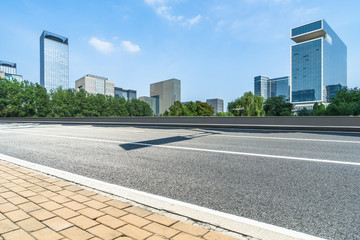 Fototapeta premium urban traffic road with cityscape in background, China.