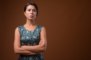 Portrait of beautiful multi ethnic businesswoman with hair tied