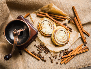 Fresh cinnamon buns on the rustic wooden background. Selective focus. Shallow depth of field.
