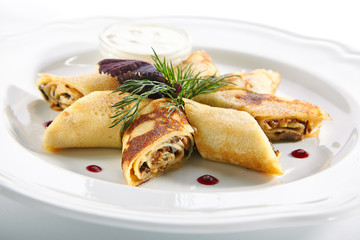 Thin Pancakes Rolls or Crepes Roulade Stuffed with Mushrooms