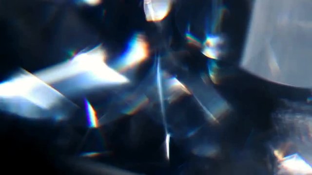Animation light leak on black background .Light Leaking Reflection of a Glass, Crystal, Defocused Shining Colorful rainbow Light Leaks, Rays on Black Background. 4K UHD video.