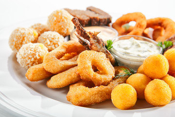 Beer Snacks or Beer Plate with Fried Seafood, Onion, Cheese and Sauces