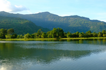Fototapeta na wymiar Pond mountain and sky very beautiful view and feeling relax.