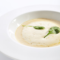 Cream soup with boletus forest mushrooms closeup