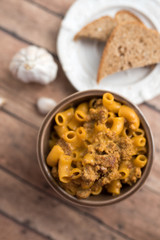 Homemade Cheeseburger Macaroni and cheese served in a small brown bowl made with ground turkey