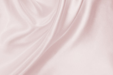 Fototapeta na wymiar Delicate satin draped fabric pink texture for festive backgrounds