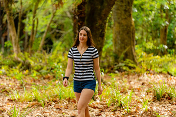 Young woman walking in parkland 