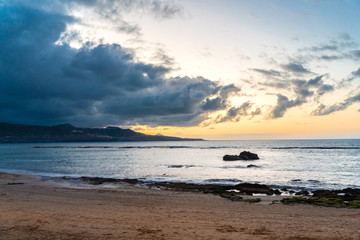Fototapeta na wymiar Sunset with some clouds at Las Canteras beach