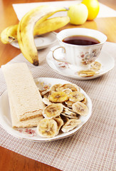 Tea with fruit chips made of bananas and crispbreads. Healthy vegetarian dietary breakfast