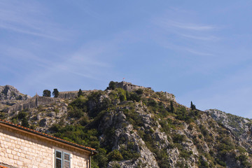 Fototapeta na wymiar An old fortress on top of a mountain.