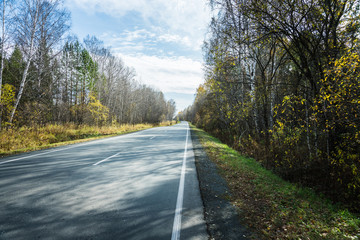 Highway and beautiful autumn landscape. Selective focus.