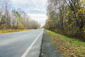 Highway and beautiful autumn landscape. Selective focus.