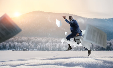 Businessman running in a hurry. Mixed media