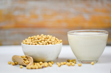 Soybean and dried soy beans on white bowl - Soy milk in glass for healthy diet drink and natural bean protein