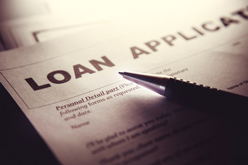 Close up a Loan Application form paper with pen , home loan or personal loan application concept