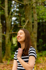 Young woman walking in parkland 