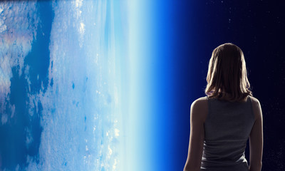 Girl looking at Earth planet