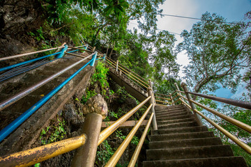 background of the wooden or steel bridges built to facilitate the journey up the high mountains(Stairs to Hilltop Pagoda,Wat Tham Seua Krabi) blurred by the wind blowing through and surrounded by tree