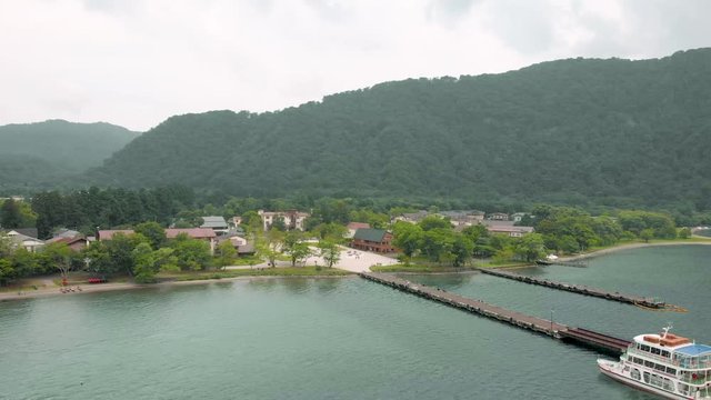 Drone dolly shoot with lake ,mountain view and ferry pier