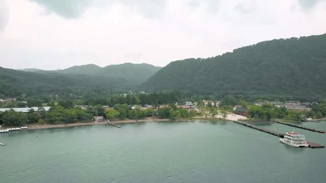 Drone dolly shoot with lake ,mountain view and ferry pier