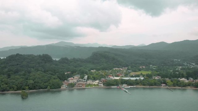 Drone pan shoot with lake ,mountain view and ferry pier