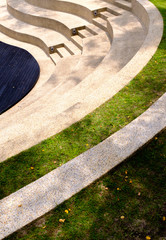 the steps of the outdoor grass seating in park view