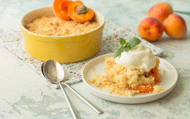 Crumble apricot pie on white table, morning dessert