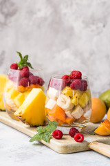 Fresh healthy fruit salad. Selective focus. Natural eating. Fruit salad on white background - diet,...